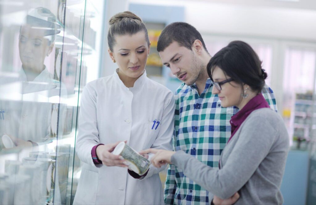 customers getting advice from a pharmacist