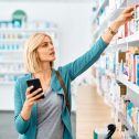 a woman looking for a medicine at a pharmacy