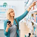 a woman looking for a medicine at a pharmacy