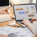 two business people managing costs