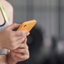 A woman excercising with a mobile phone